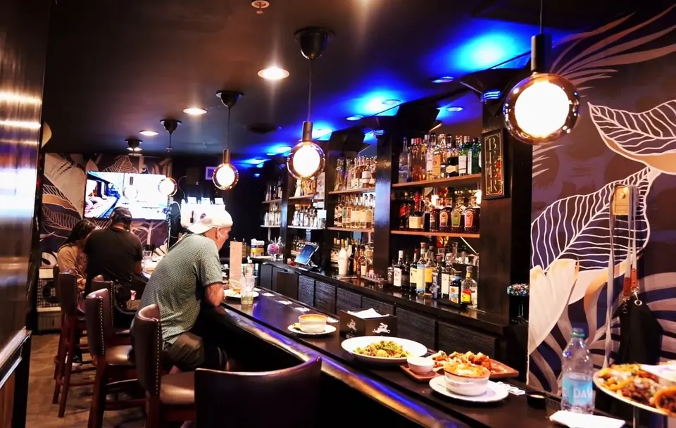 The bar under the leaf wallpaper